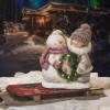 Julefigurer - Pige og snemand med LED krans